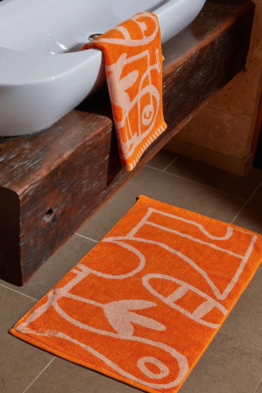---Speechless Orange Bath Mat